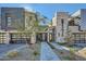 Modern luxury home with stone and metal accents, walkway, and landscaping at 37200 N Cave Creek Rd # 1119, Scottsdale, AZ 85262