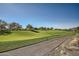 Expansive green golf course with rolling hills and paved pathway at 37200 N Cave Creek Rd # 1119, Scottsdale, AZ 85262