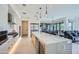 Modern kitchen with white cabinets, marble island, and stainless steel appliances at 37200 N Cave Creek Rd # 1119, Scottsdale, AZ 85262
