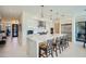 Modern kitchen with white cabinets, marble island, and stainless steel appliances at 37200 N Cave Creek Rd # 1119, Scottsdale, AZ 85262