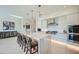 Modern kitchen with white cabinets, marble island, and stainless steel appliances at 37200 N Cave Creek Rd # 1119, Scottsdale, AZ 85262