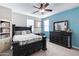 Bedroom with a double bed, dresser and blue accent wall at 3836 E Gideon Way, Gilbert, AZ 85296