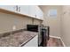 Laundry room with white cabinets, washer, dryer, and ample counter space at 4226 W Avenida Del Rey --, Phoenix, AZ 85083