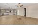 Open living area with tile floors and kitchen views at 43576 W Snow Dr, Maricopa, AZ 85138