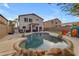 Relaxing backyard oasis with pool and grassy area at 438 E Palomino Way, San Tan Valley, AZ 85143