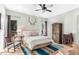 King bedroom with ceiling fan, wooden accents, and southwestern decor at 5411 E Seven Palms Dr, Cave Creek, AZ 85331