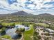 Aerial view of Rancho Manana community, featuring a golf course and lake at 5622 E Sugarloaf Trl, Cave Creek, AZ 85331