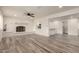 Living room with fireplace and open layout to kitchen at 6449 W Hatcher Rd, Glendale, AZ 85302