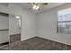 Bright bedroom with ceiling fan, mirrored closet, and neutral carpeting at 6900 E Princess Dr # 1256, Phoenix, AZ 85054