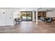 View through the entryway showing the pool, fireplace and dining area at 7255 N 12Th St, Phoenix, AZ 85020