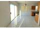 Bright dining area with tiled floors and sliding glass door to patio at 7402 S 40Th Ln, Phoenix, AZ 85041