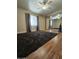 Bright bedroom with mirrored closet and ceiling fan at 8600 E Broadway Rd # 55, Mesa, AZ 85208