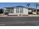 Single-wide manufactured home with carport and landscaping at 8600 E Broadway Rd # 55, Mesa, AZ 85208