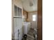 Bright laundry room with washer, dryer, and cabinets at 8600 E Broadway Rd # 55, Mesa, AZ 85208