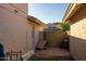 Small backyard patio with storage and a wheelbarrow at 9411 S 45 Pl, Phoenix, AZ 85044