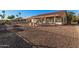 Backyard with gravel, cactus plants, and partial home view at 1211 E Torrey Pines Ln, Chandler, AZ 85249