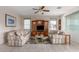 Living room with two sofas, wood cabinet, and tile flooring at 1211 E Torrey Pines Ln, Chandler, AZ 85249