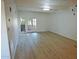 Bright living room featuring wood-look floors and access to patio at 1217 N Miller Rd # 8, Scottsdale, AZ 85257