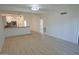 Spacious living room with light wood floors and kitchen views at 1217 N Miller Rd # 8, Scottsdale, AZ 85257