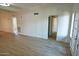 Open living area with wood-look floors and access to patio at 1217 N Miller Rd # 8, Scottsdale, AZ 85257