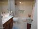 Bathroom with tub, toilet and single vanity at 13059 W Blue Sky Dr, Sun City West, AZ 85375