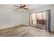 Bright bedroom with laminate floors and patio access at 1328 S Mckemy St, Tempe, AZ 85281