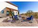 Large patio with fire pit and comfortable seating area at 13420 E Jomax Rd, Scottsdale, AZ 85262