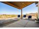 Covered patio with seating area and stunning desert views at 13420 E Jomax Rd, Scottsdale, AZ 85262