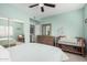 Serene bedroom featuring a queen bed, dresser and ceiling fan at 15225 N 100Th St # 2224, Scottsdale, AZ 85260