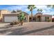 Single story house with a two-car garage and cacti at 1637 N Sunview --, Mesa, AZ 85205