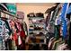 Large walk-in closet with ample shelving and hanging space at 17642 N Whispering Oaks Dr, Sun City West, AZ 85375