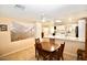 Dining area with a table and chairs, overlooking kitchen at 17642 N Whispering Oaks Dr, Sun City West, AZ 85375