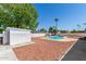 Spacious backyard with a refreshing pool, storage shed, and desert landscaping at 2636 E Lupine Ave, Phoenix, AZ 85028