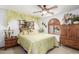 Bedroom with wood furniture and ceiling fan at 2636 E Lupine Ave, Phoenix, AZ 85028