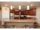 Modern kitchen with stainless steel appliances and an island at 27238 W Mohawk Ln, Buckeye, AZ 85396