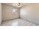 Bright bedroom with tile floors and a window with blinds at 3120 N 67Th Ln # 47, Phoenix, AZ 85033