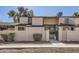 Tan two-story townhome with a gated entry and landscaping at 3120 N 67Th Ln # 47, Phoenix, AZ 85033