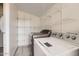 Laundry room with washer, dryer, and wire shelving at 3120 N 67Th Ln # 47, Phoenix, AZ 85033