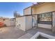 Private patio with brick pavers and access to a storage unit at 3120 N 67Th Ln # 47, Phoenix, AZ 85033