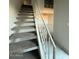 Carpeted staircase leading to the upper level at 3120 N 67Th Ln # 47, Phoenix, AZ 85033