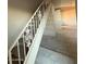 Indoor staircase with carpet and ornate railing at 3120 N 67Th Ln # 47, Phoenix, AZ 85033