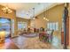 Formal dining room with wood table and chairs, and adjacent seating area at 3762 S Rosemary Dr, Chandler, AZ 85248