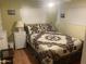 Cozy bedroom with a double bed and wood flooring at 4065 E University Dr # 155, Mesa, AZ 85205