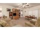 Bright living room featuring built-in shelving and a cozy seating arrangement at 4486 W Crescent Rd, Queen Creek, AZ 85144