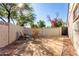 Private backyard patio with lounge chairs and small tree at 4725 N 14Th Ave, Phoenix, AZ 85013