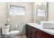Clean bathroom with dark brown vanity and white tile at 4725 N 14Th Ave, Phoenix, AZ 85013