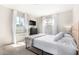 Bedroom with a queen bed, window, and built-in desk at 4725 N 14Th Ave, Phoenix, AZ 85013