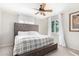 Comfortable bedroom boasting a large bed, ceiling fan, and ample natural light at 4725 N 14Th Ave, Phoenix, AZ 85013