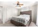 Spacious bedroom with plush bed, ceiling fan, and large window at 4725 N 14Th Ave, Phoenix, AZ 85013