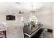 Open concept dining room with large table and modern lighting at 4725 N 14Th Ave, Phoenix, AZ 85013